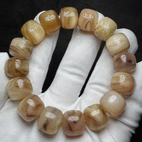 YS-YS14-001-yellow-chalcedony-barrel-bracelet Natural yellow chalcedony barrel-cut bracelet, honey amber tones, hand-polished beads on white cloth